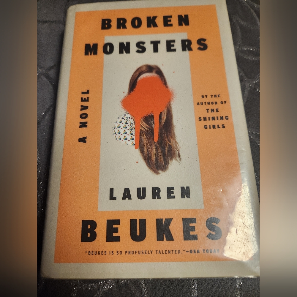 Monsters by Lauren Beukes - Orange and White Hardcover
